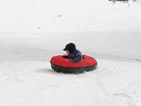 67-sequence_photos_of_Kenny_tubing_down_the_hill