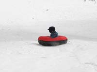 68-sequence_photos_of_Kenny_tubing_down_the_hill