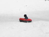70-sequence_photos_of_Kenny_tubing_down_the_hill