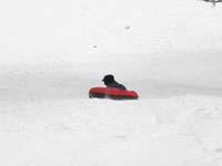 72-sequence_photos_of_Kenny_tubing_down_the_hill