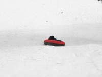73-sequence_photos_of_Kenny_tubing_down_the_hill