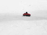 77-sequence_photos_of_Kenny_tubing_down_the_hill