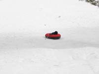 78-sequence_photos_of_Kenny_tubing_down_the_hill
