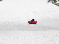 79-sequence_photos_of_Kenny_tubing_down_the_hill