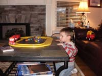 01-Kenny_dives_right_into_the_toys_at_Grammy_and_Grandpa_Duke's