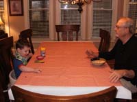 03-Kenny_and_Grandpa_Duke_eating_breakfast_and_playing_with_a_car