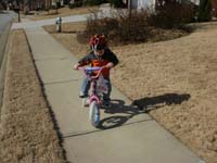 59-Kenny_pedals_the_bike-he_picked_up_the_coordination_to_pedal_a_bike_quickly