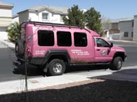 44-big_pink_truck_parked_in_front_of_the_house