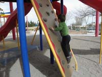 31-Kenny_on_the_rock_wall_again-he_figured_out_where_to_put_his_hands_and_feet