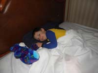 17-Kenny's_pretty_excited_to_sleep_in_the_big_hotel_bed_by_himself