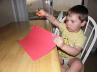 01-Kenny_cutting_paper-in_his_underwear
