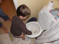 10-Kenny_cleans_the_toilet