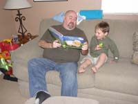 13-Jeff_Jones_visits_and_reads_a_book_to_Kenny
