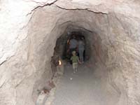 34-Kenny_walking_into_another_area_of_the_mine