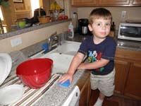 01-quite_the_little_helper-Kenny_wanted_to_clean_the_kitchen_counter