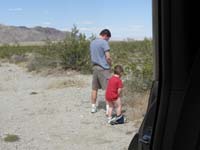 011-Daddy_helps_Kenny_by_showing_him_how_to_do_it_standing_up_in_the_desert
