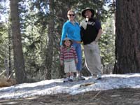 075-family_standing_in_snowy_woods