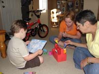 25-Kenny_reading_the_instructions_for_Handy_Manny_toolbox