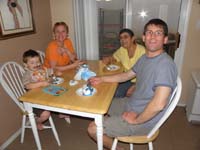 39-Kenny_Mommy_Baba_and_Daddy_eating_ice_cream_cake