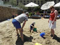 82-Kenny_plays_in_the_sand_while_Poppy_and_Mommy_watch