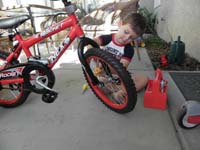02-Kenny_uses_Handy_Mandy_Tools_to_fix_his_bike
