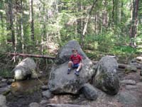 037-Kenny_on_a_another_rock_by_the_stream_at_our_campsite