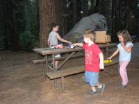 043-kids_spent_a_lot_of_time_with_toy_trucks_on_the_picnic_table