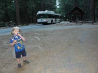 072-Kenny_at_Happy_Isles_bus_stop_with_shuttle_bus-ready_to_try_hiking_to_Vernal_Fall