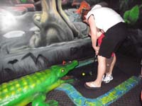 32-Mommy_helping_Kenny_putt_into_the_aligators_mouth