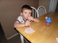 02-Kenny_cleans_up_spilt_smoothie_with_a_straw