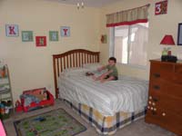 27-Kenny's_happy_with_his_bigger_boy_bed-Daddy's_old_bed_he's_had_since_1996-it's_very_comfortable
