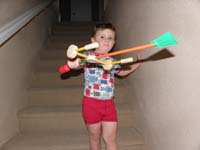 35-Kenny_shows_off_his_rocket_he_made_with_Tinker_Toys