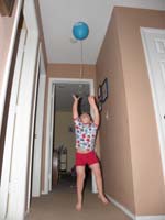 36-Kenny_jumps_to_grab_his_balloon