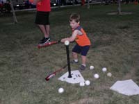 55-Kenny's_first_T-ball_practice-he_takes_a_swing_at_the_ball