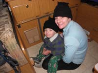 39-Kenny_and_Mommy_bundled_up_sitting_by_the_heater_in_the_morning-only_lower_40s_outside