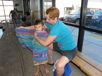 24-Kenny_likes_to_be_wrapped_up_and_carried_to_the_bathroom_to_be_changed