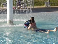 19-Kenny_dragging_Daddy_to_the_mushroom_water_feature