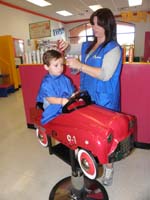 71-Kenny_getting_his_haircut-maybe_the_last_time_in_the_fire_truck-he's_getting_so_big