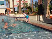 02-Poppy_catches_Kenny_jumping_into_the_pool