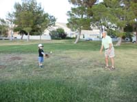 09-T-ball_practice-Grandpa_Duke_plays_catch_with_Kenny