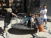 22-merry_go_round_fun-Kenny_running_in_mid-air