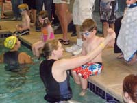 06-instructor_giving_Kenny_quick_reminder_on_how_to_swim