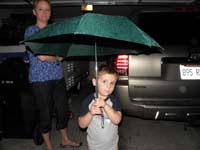 02-Kenny_greets_Daddy_with_an_umbrella_after_work-rare_days_it_rains_in_Las_Vegas