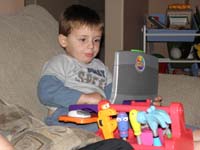 39-Kenny_playing_quietly_with_his_favorite_computer