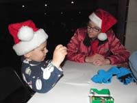 11-Kenny_draws_what_he_wants_for_Christmas_to_put_in_Santa's_mailbox