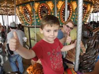 087-Kenny_and_Mommy_on_the_Merry-Go-Round