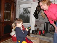 01-Kenny_opening_his_stocking-snow_falling_outside