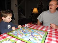 18-Grandpa_Duke_and_Kenny_playing_Chutes_and_Ladders