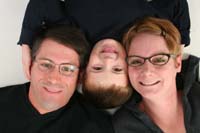 02-family_laying_down_with_heads_together