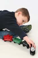 06-Kenny_playing_with_his_train